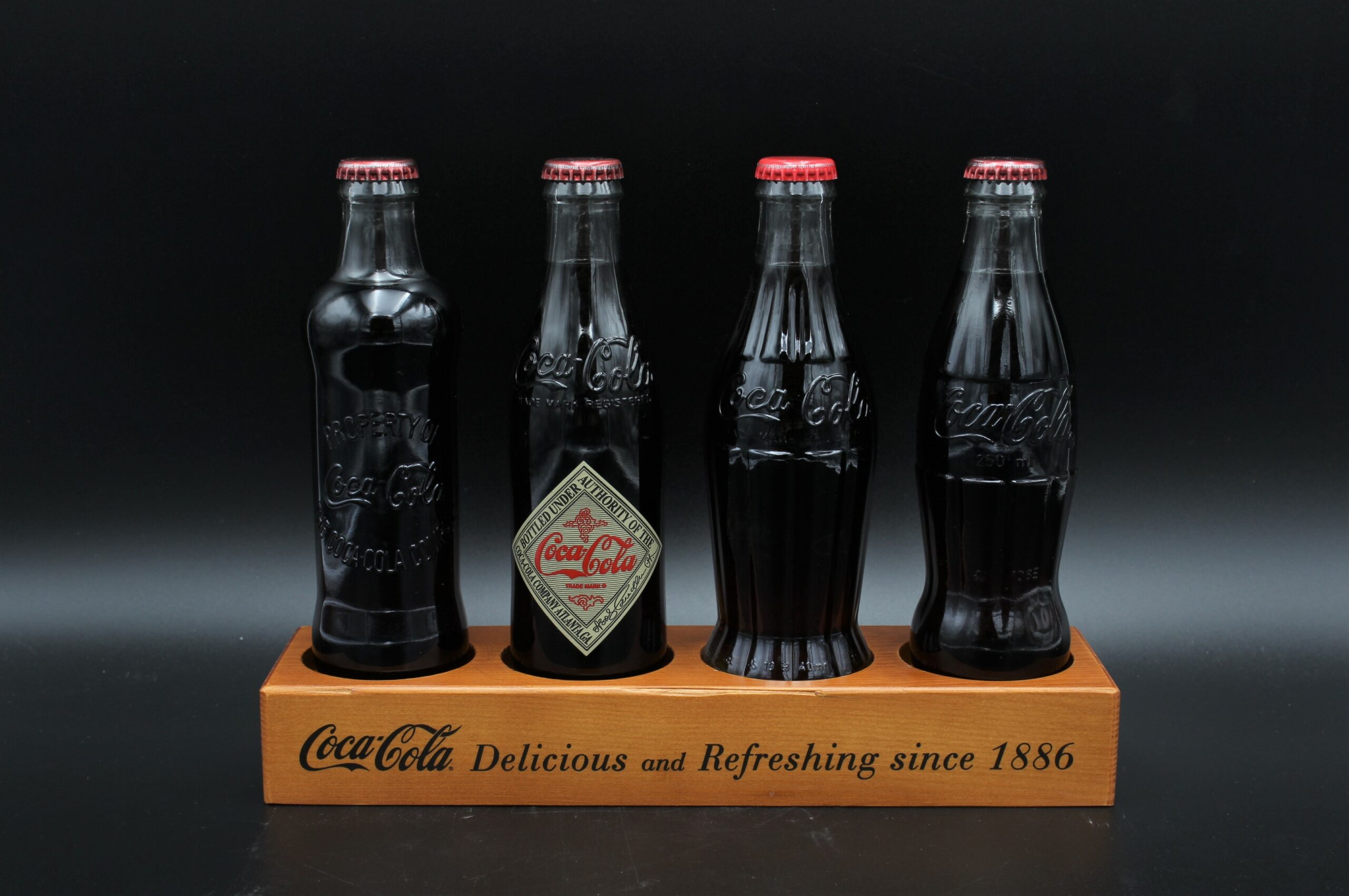 Coca-Cola / 4 Bottle Display Delicious and Refreshing since 1886 Image