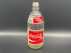 Coca-Cola / 64 Oz. Size / Plastic Coated Bottle Image