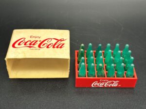 Coca-Cola / Plastic Mini Bottles in Red Plastic Crate Image