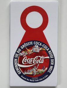 Coca-Cola / Gewinnen Sie Die Grösste Reise Der Welt / Bottle Hanger Image